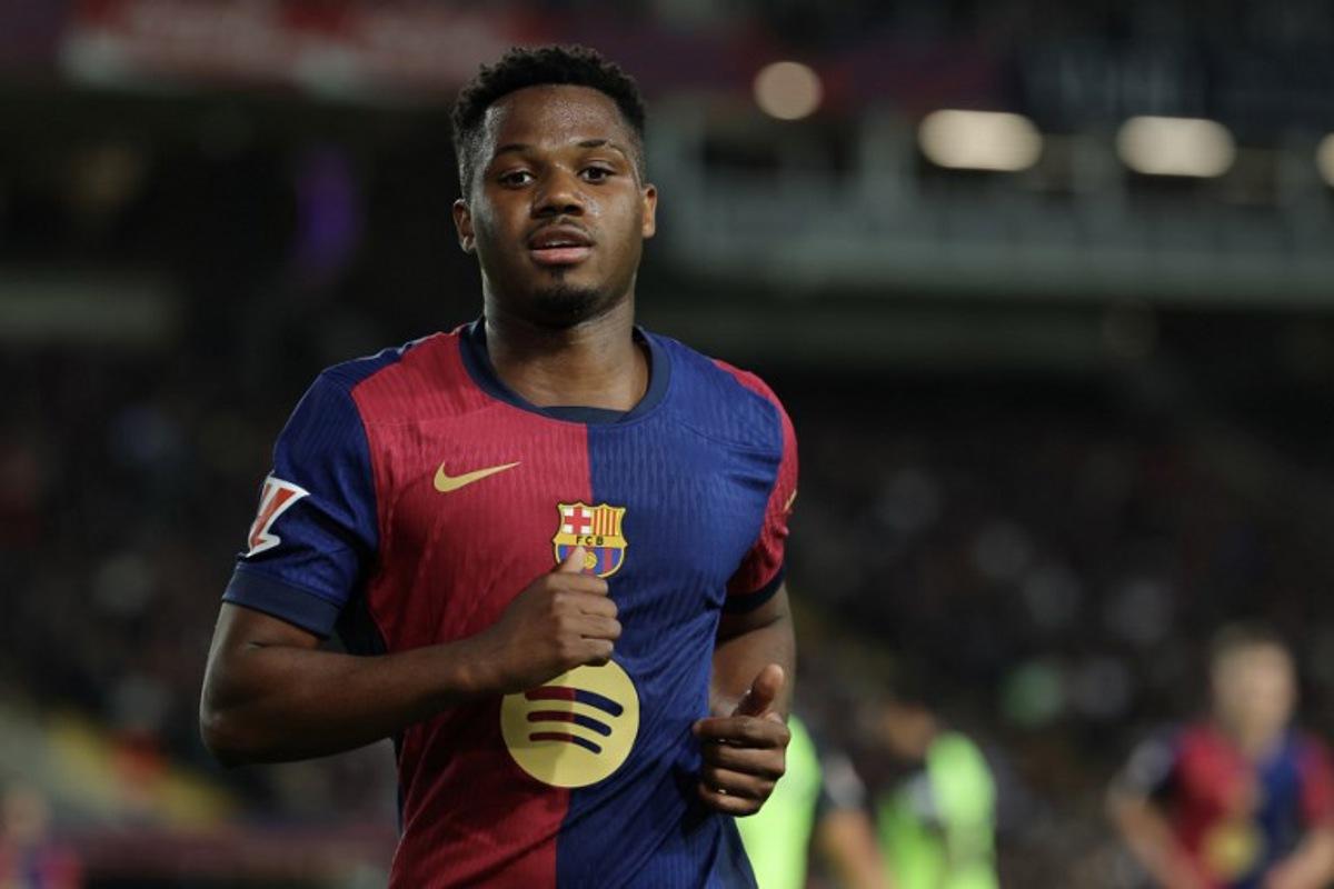 Barcelona's Spanish forward #10 Ansu Fati runs during the Spanish league football match between FC Barcelona and RCD Mallorca at the Estadi Olimpic Lluis Companys in Barcelona, on April 22, 2025.  LLUIS GENE / AFP