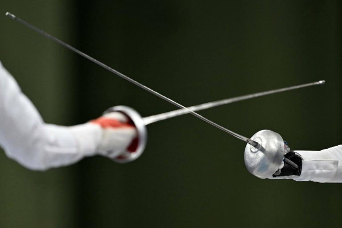 China's Tang Junyao and Italy's Alberta Santuccio compete in the women's epee team semi-final bout during the Paris 2024 Olympic Games at the Grand Palais in Paris, on July 30, 2024.  Fabrice COFFRINI / AFP