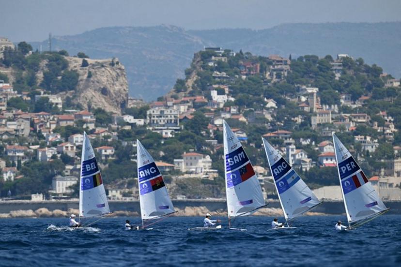 (LtoR) Belgium's William De Smet, Angola's Filipe Andre, Samoa's Eroni Leilua, Argentina's Francisco Guaragna Rigonat and Peru's Stefano Peschiera compete in race 7 of the men's ILCA 7 single-handed dinghy event during the Paris 2024 Olympic Games sailing competition at the Roucas-Blanc Marina in Marseille on August 4, 2024.   NICOLAS TUCAT / AFP