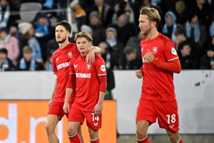 FC Twente's Dutch forward #09 Ricky van Wolfswinkel (L) celebrates with Sem FC Twente's Dutch midfielder #14 Sem Steijn (C) and FC Twente's Dutch midfielder #18 Michel Vlap after the 1-2 goal from a penalty shot by van Wolfswinkel during the UEFA Europa League football match between Malmoe FF and FC Twente in Malmoe, on January 23, 2025.  Johan NILSSON / TT NEWS AGENCY / AFP