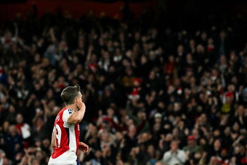 Arsenal's Belgian midfielder #19 Leandro Trossard celebrates after scoring his team second goal during the English Premier League football match between Arsenal and Crystal Palace at the Emirates Stadium in London on April 23, 2025.   Ben STANSALL / AFP