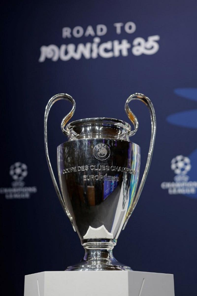 A photo shows European Champion Clubs' Cup trophy displayed on set prior to the draw for the round of 16 of the 2024-2025 UEFA Champions League football tournament at the House of European Football in Nyon, on February 21, 2025.  Valentin Flauraud / AFP