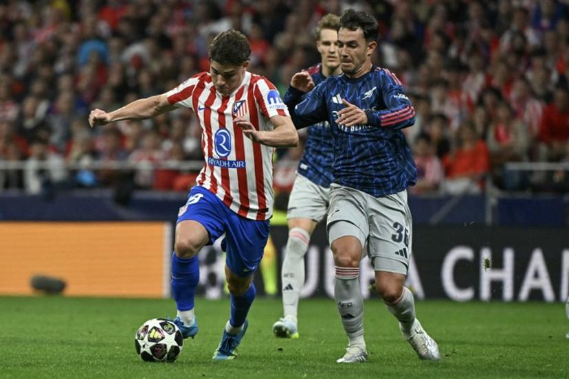 Atletico Madrid's Argentine forward #19 Julian Alvarez (L) vies for the ball with Arsenal's Spanish defender #36 Martin Zubimendi during the UEFA Champions League semi-final first leg football match between Club Atletico de Madrid and Arsenal at the Metropolitano stadium in Madrid on April 29, 2026.  Javier SORIANO / AFP