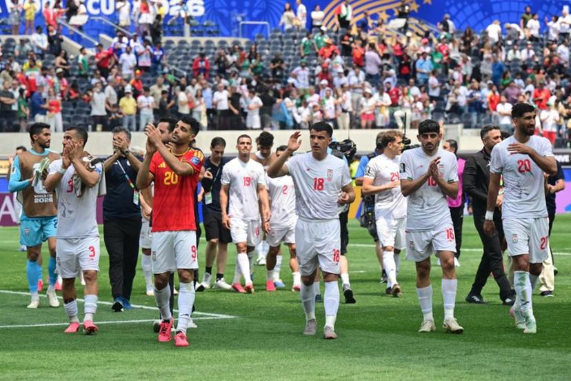 Iran's players celebrate at the end of the 2026 World Cup Group G football match between Belgium and Iran at the Los Angeles Stadium in Inglewood on June 21, 2026. Frederic J. Brown / AFP