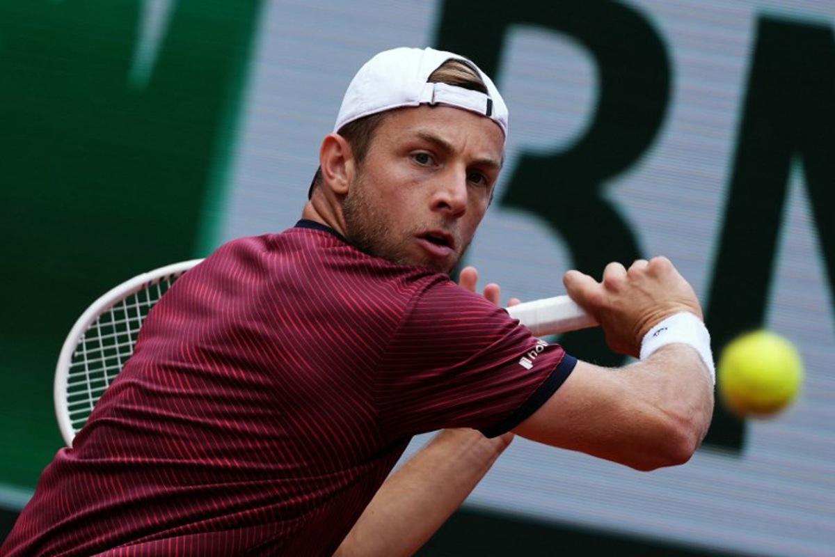 Netherlands' Tallon Griekspoor plays a backhand return to Germany's Alexander Zverev during their men's singles match on day 9 of the French Open tennis tournament on Court Suzanne-Lenglen at the Roland-Garros Complex in Paris on June 2, 2025.  Dimitar DILKOFF / AFP