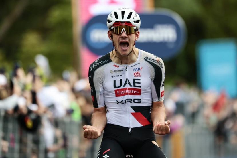 UAE Team Emirates - XRG Spanish rider Igor Arrieta celebrates as he crosses the finish line to win the 5th stage of the Giro d'Italia 2026 - Tour of Italy cycling race between Praia a Mare and Potenza, southern Italy on May 13, 2026.  Luca BETTINI / AFP