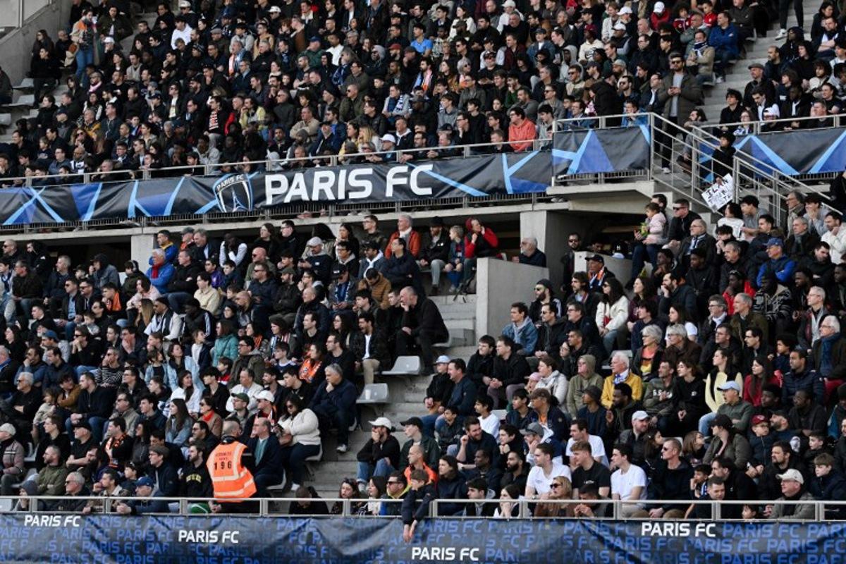 Paris FC's supporters attend the Ligue 2 football match between Paris FC and Lorient at the Charlety Stadium in Paris on March 8, 2025.  Anna KURTH / AFP