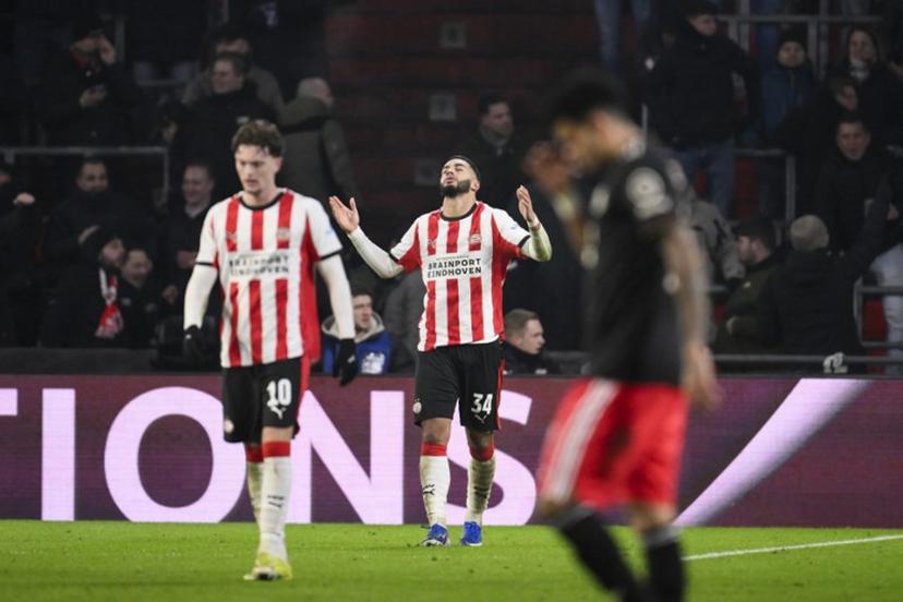 PSV Eindhoven's Moroccan midfielder #34 Ismael Saibari (C) celebrates after scoring his team's first goal during the UEFA Champions League league phase day 8 football match between PSV Eindhoven and Bayern Munich at Philips Stadion in Eindhoven on January 28, 2026.  JOHN THYS / AFP