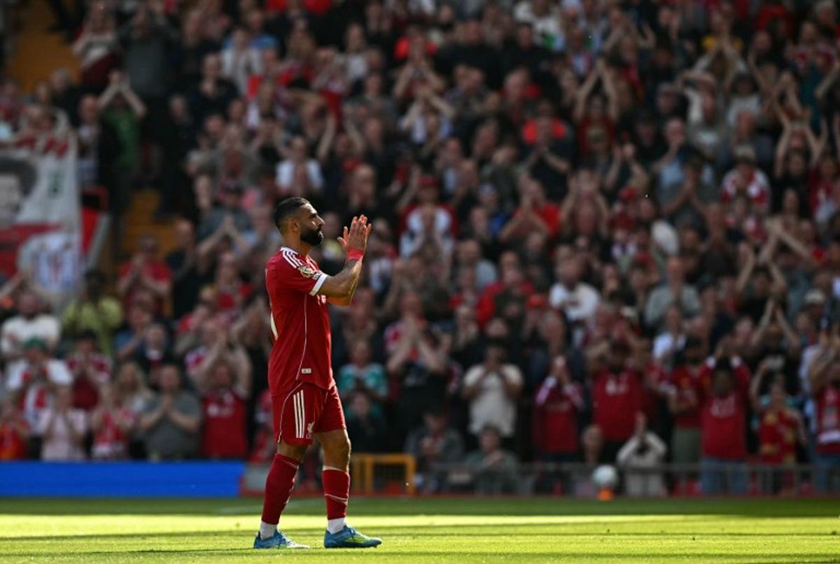 Liverpool's Egyptian striker #11 Mohamed Salah applauds the fans as he leaves the pitch injured during the English Premier League football match between Liverpool and Crystal Palace at Anfield in Liverpool, north west England on April 25, 2026.  Paul ELLIS / AFP