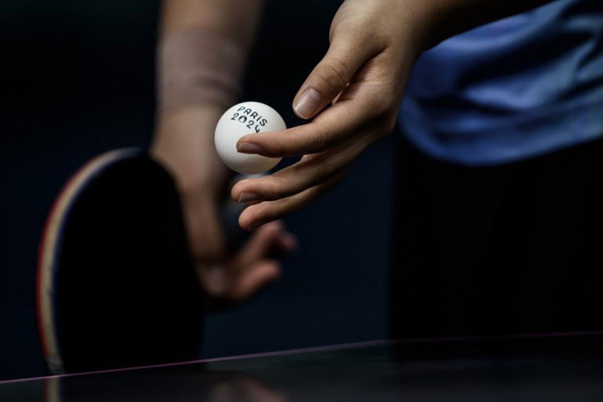 South Korea's Shin Yubin prepares to serve to Japan's Miu Hirano during their women's table tennis singles quarter-finals at the Paris 2024 Olympic Games at the South Paris Arena in Paris on August 1, 2024.   JEFF PACHOUD / AFP