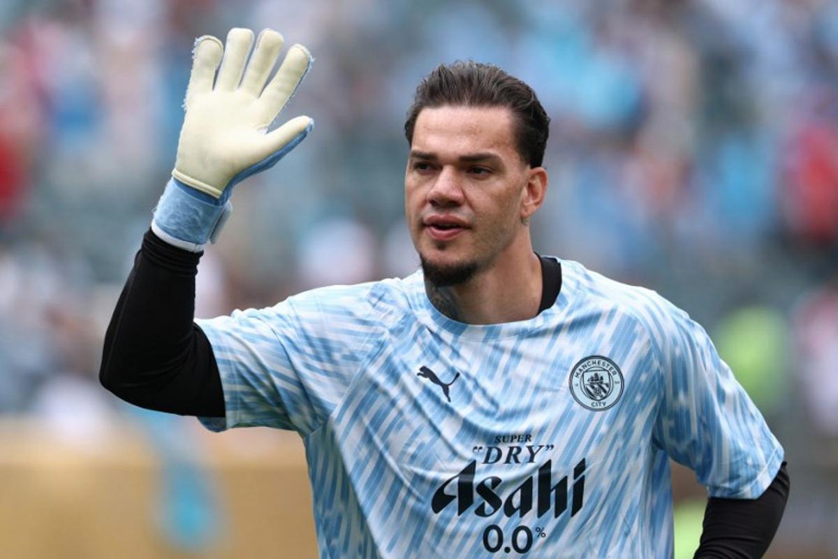 Manchester City's Brazilian goalkeeper #31 Ederson waves prior to the FIFA Club World Cup 2025 Group G football match between England's Manchester City and Morocco's Wydad AC at the Lincoln Financial Field stadium in Philadelphia on June 18, 2025.  FRANCK FIFE / AFP