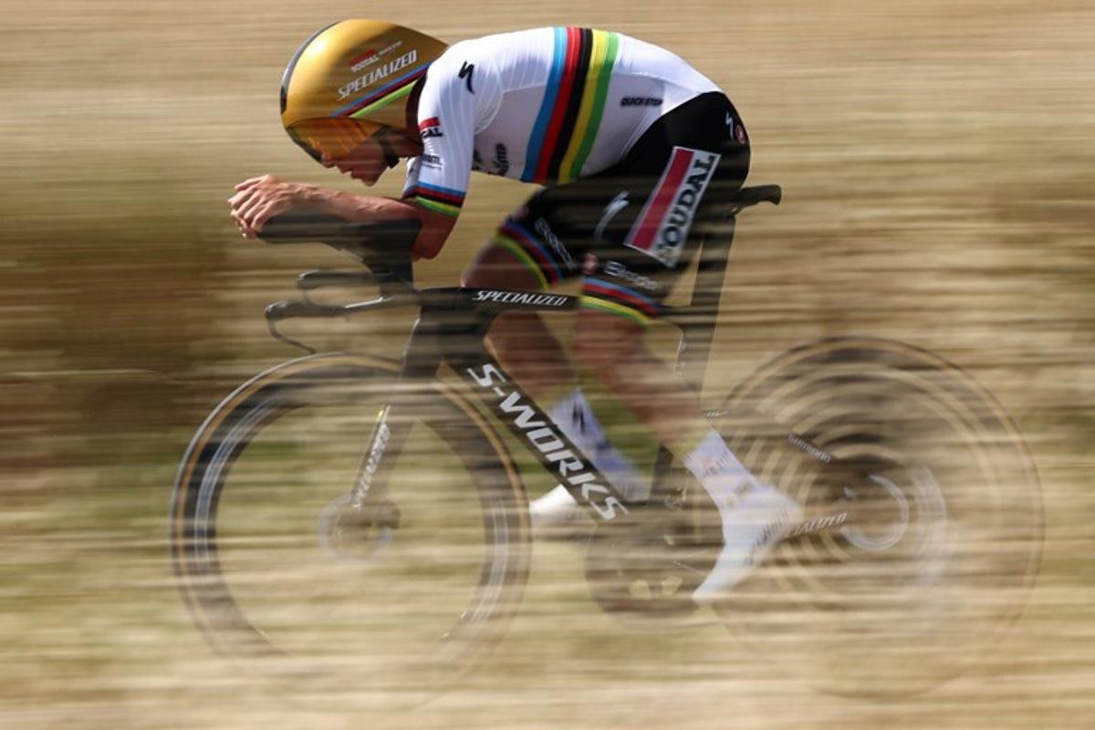Soudal Quick-Step's Belgian rider Remco Evenepoel cycles during the 4th stage of the 77th edition of the Criterium du Dauphine cycling race, a 17,4 km individual time trial between Charmes-sur-Rhône and Saint-Péray, on June 11, 2025.  Anne-Christine POUJOULAT / AFP