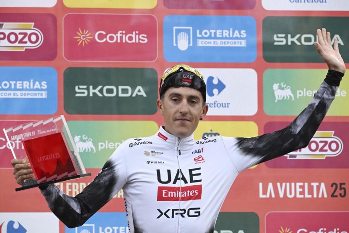 Team UAE's Spanish rider Marc Soler celebrates on the podium after winning the 14th stage of the Vuelta a Espana cycling tour, a 135 km race between Aviles and La Farrapona in Somiedo, on September 6, 2025.    Miguel RIOPA / AFP