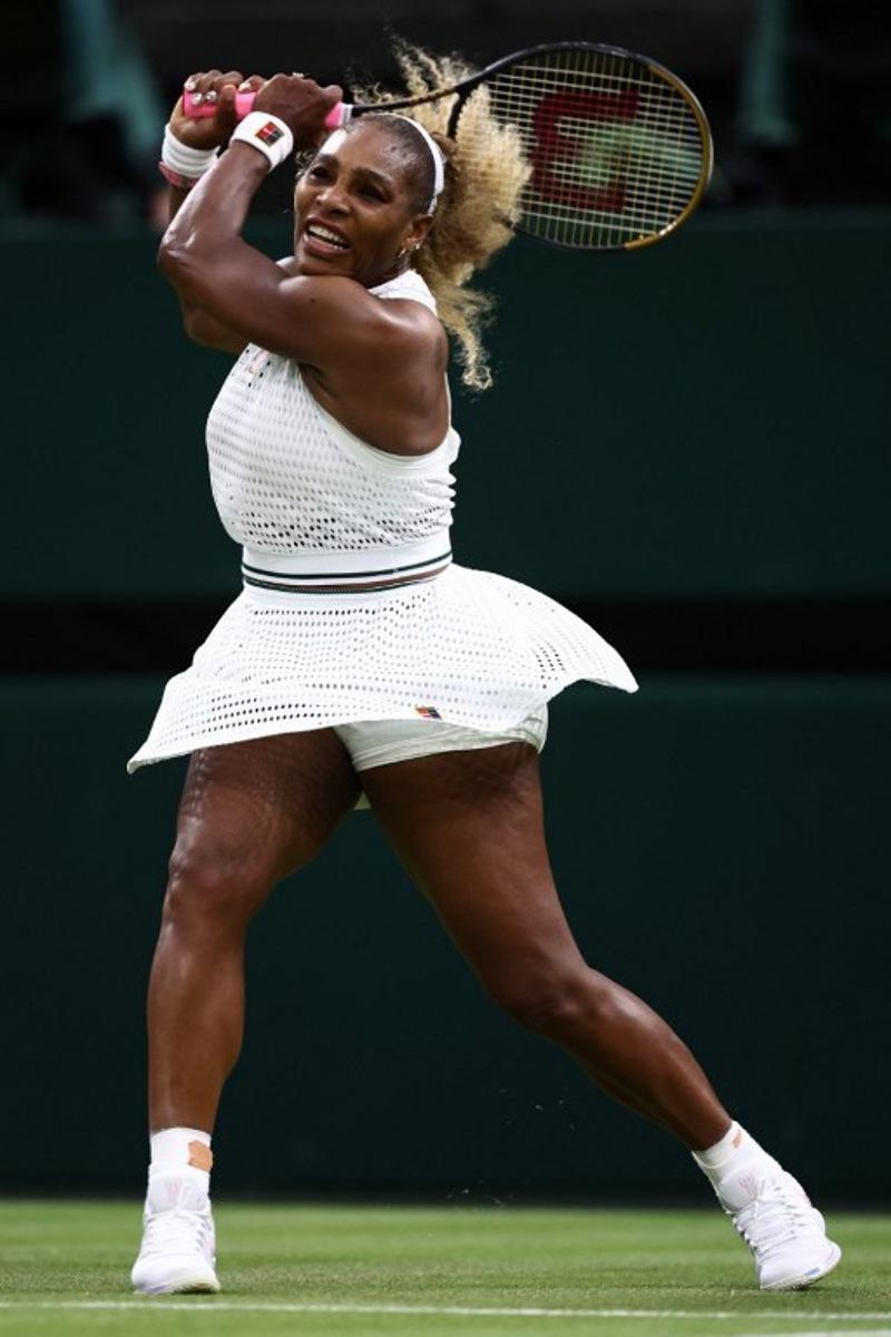 US player Serena Williams returns the ball to Australia's Maya Joint during their women's singles first round tennis match on the second day of the 2026 Wimbledon Championships at The All England Lawn Tennis and Croquet Club in Wimbledon, southwest London, on June 30, 2026.  HENRY NICHOLLS / AFP
