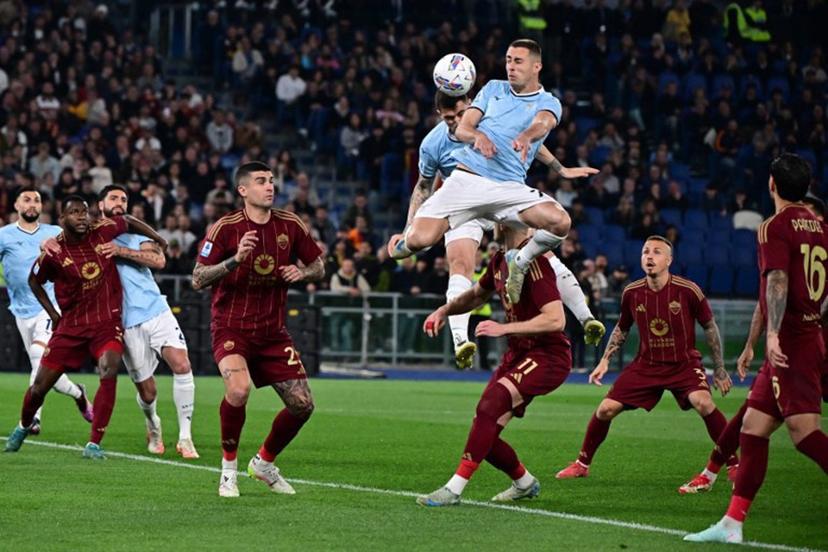 Lazio's Montenegrin defender #77 Adam Marusic jumps for the ball during the Italian Serie A football match between Lazio and Roma at the Olympic Stadium in Rome on April 13, 2025.  Tiziana FABI / AFP