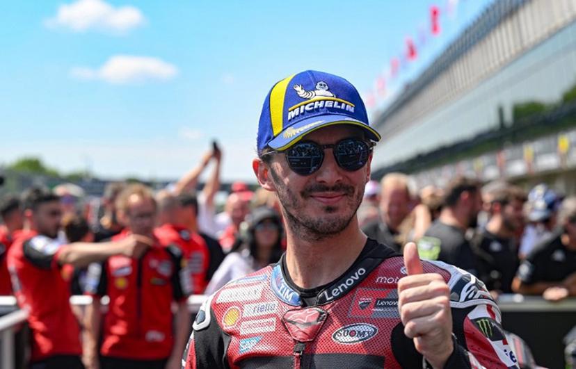 (FILES) Third placed Team Ducati Lenovo Team's Francesco Bagnaia shows the thumb up after the MotoGP Grand Prix of Czechia in Brno, Czech Republic, on June 21, 2026. Two-time former MotoGP champion Francesco Bagnaia will leave Ducati's factory team at the end of the season and will be replaced by rising star Pedro Acosta, the Italian manufacturer said on June 24, 2026. Michal Cizek / AFP