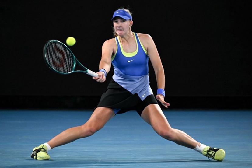 Russia's Mirra Andreeva hits a return to Romania's Elena-Gabriela Ruse during their women's singles match on day six of the Australian Open tennis tournament in Melbourne on January 23, 2026.  WILLIAM WEST / AFP