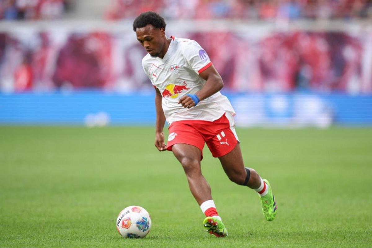 Leipzig's Belgian forward #11 Lois Openda runs with the ball during the German first division Bundesliga football match between RB Leipzig and 1. FC Heidenheim 1846 in Leipzig on August 30, 2025.  Ronny HARTMANN / AFP