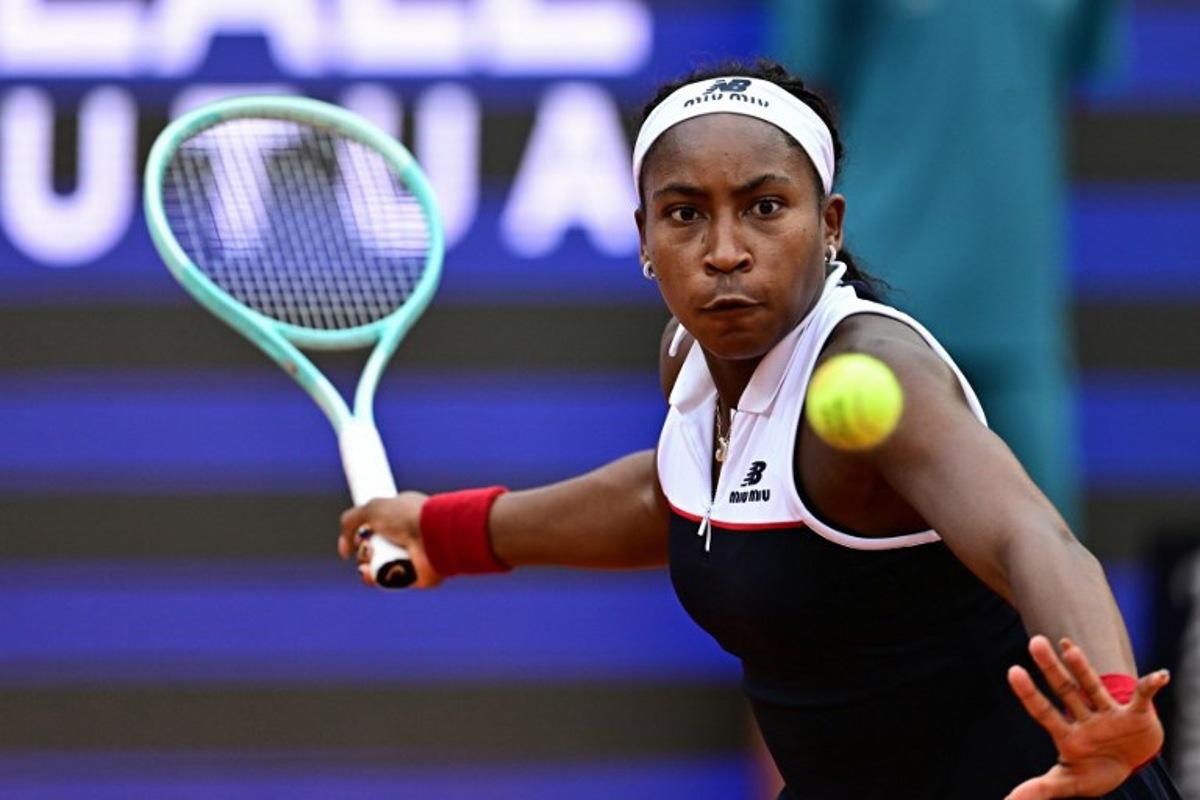 USA's Coco Gauff  plays a forehand return to Italy's Jasmine Paolini during their women's singles final match for the WTA Rome Open tennis tournament at Foro Italico in Rome on May 17, 2025.  Tiziana FABI / AFP