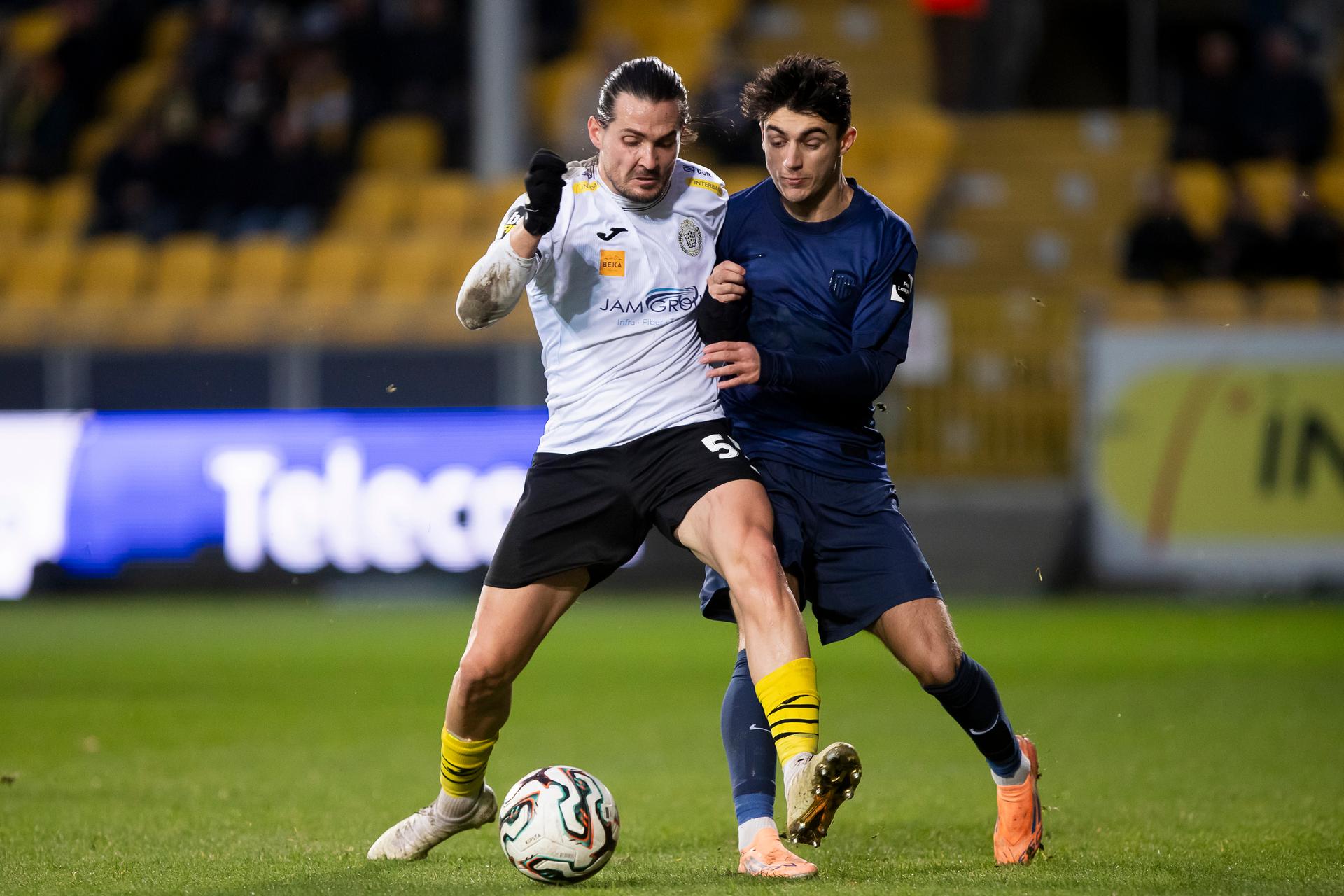 Lokeren's Sam Van Aerschot and Jong Genk's Luca Oyen pictured during a soccer game between KSC Lokeren and Jong Genk, Sunday 14 December 2025 in Lokeren, on day 17 of the 2025-2026 'Challenger Pro League' 1B second division of the Belgian championship. BELGA PHOTO KRISTOF VAN ACCOM