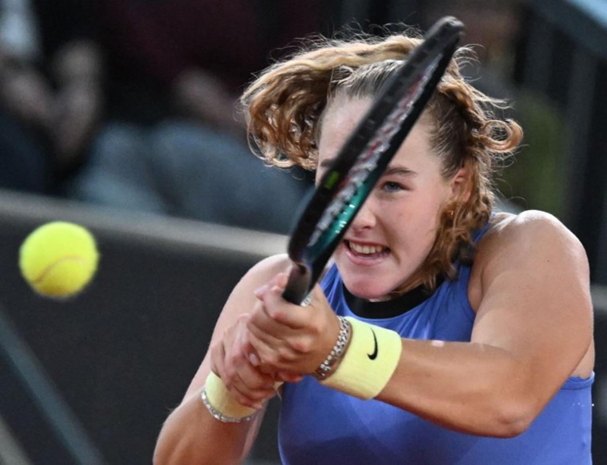 Russia's Mirra Andreeva returns the ball to Romania's Elena-Gabriela Ruse during their women's semi-final match of the WTA Upper Austria Women's Linz tennis tournament in Linz, Austria on April 11, 2026.  BARBARA GINDL / APA / AFP