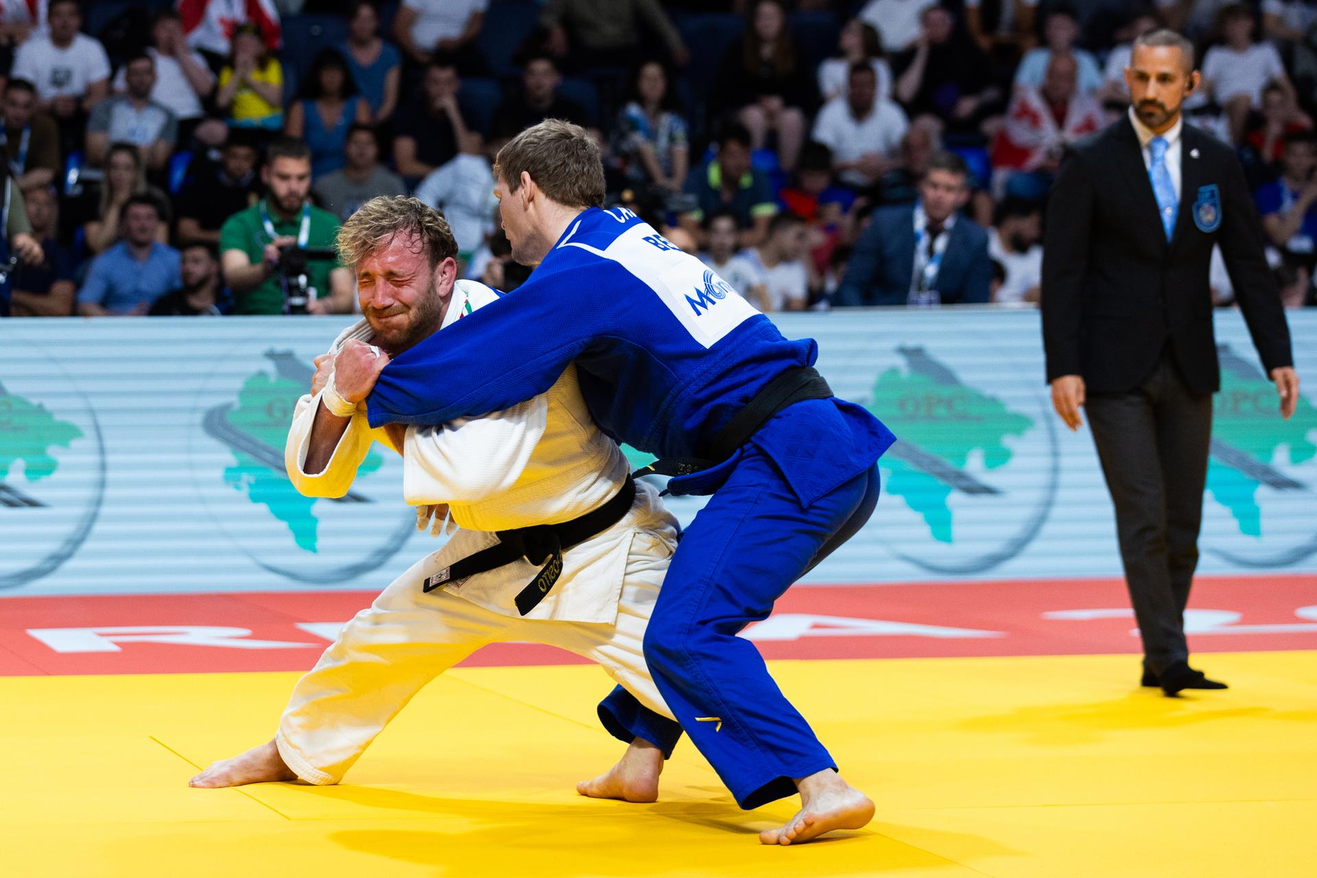 Belgian Matthias Casse (blue gi) and Italian Antonio Esposito (white gi) pictured in action during a judo bout in the Men -81kg category, at the European Judo Championships in Podgorica, Montenegro, on Friday 25 April 2025. The tournament is taking place from 23 tot 27 April 2025. BELGA PHOTO NIKOLA KRISTC