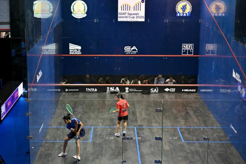 India's Joshna Chinappa (L) plays against Hong Kong, China's Ka Yi Lee during the finals match of the SDAT Squash World Cup held in Chennai on December 14, 2025.  R. Satish BABU / AFP