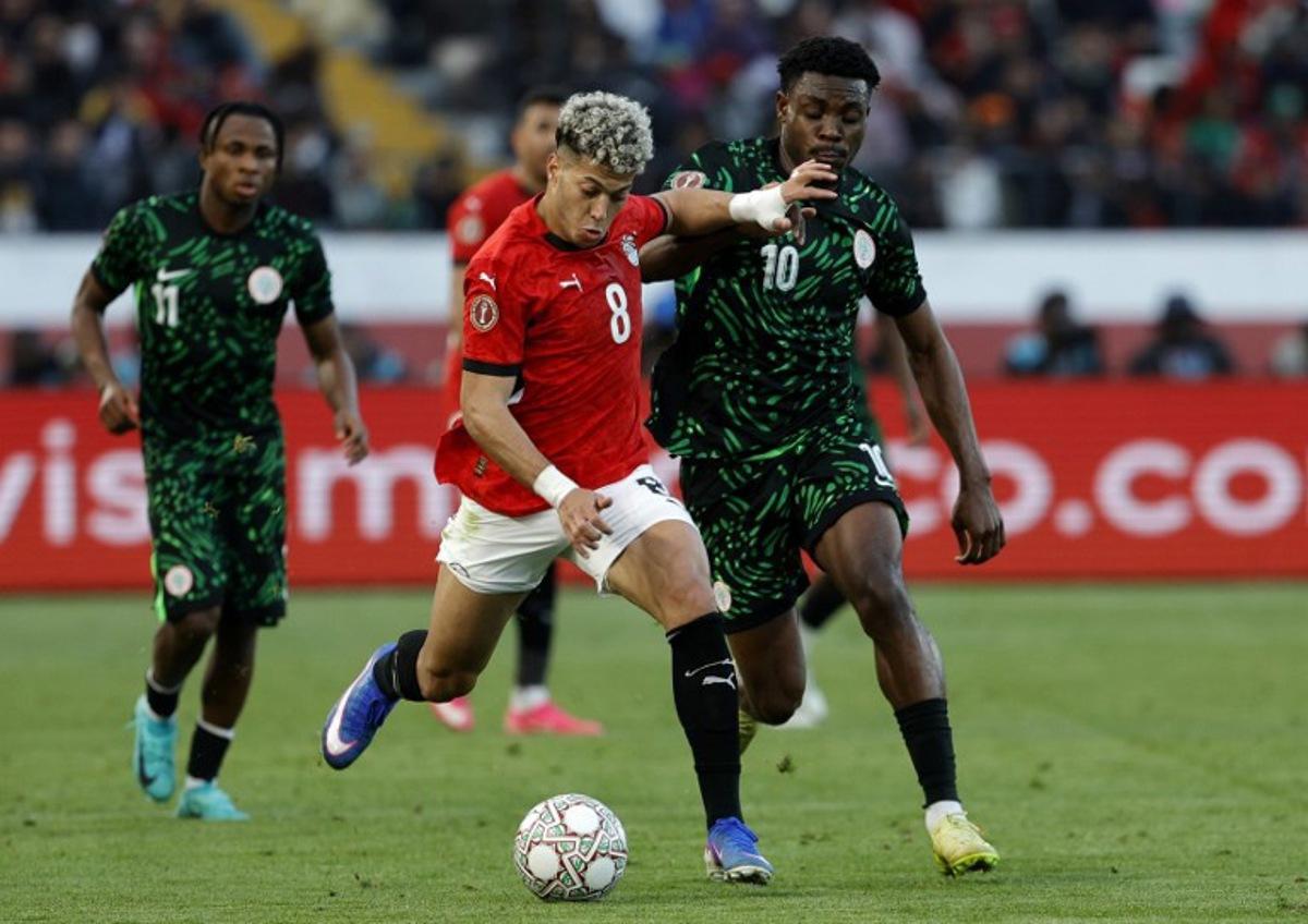 Egypt's midfielder #8 Emam Ashour and Nigeria's midfielder #10 Fisayo Dele-Bashiru compete during the Africa Cup of Nations (CAN) third place football match between Egypt and Nigeria at the Mohammed V Stadium in Casablanca on January 17, 2026.   Abdel Majid BZIOUAT / AFP