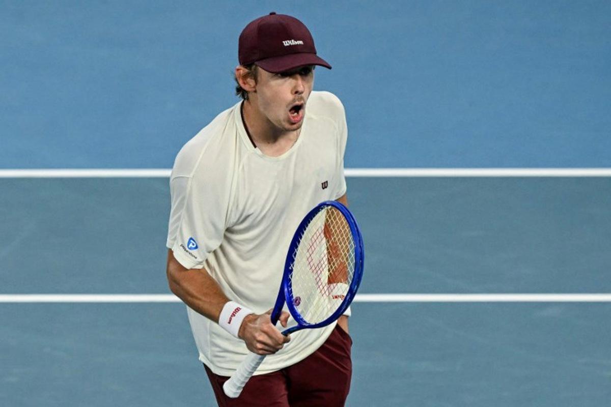 Australia's Alex De Minaur reacts after a point against USA's Frances Tiafoe during their men's singles match on day six of the Australian Open tennis tournament in Melbourne on January 23, 2026.  WILLIAM WEST / AFP