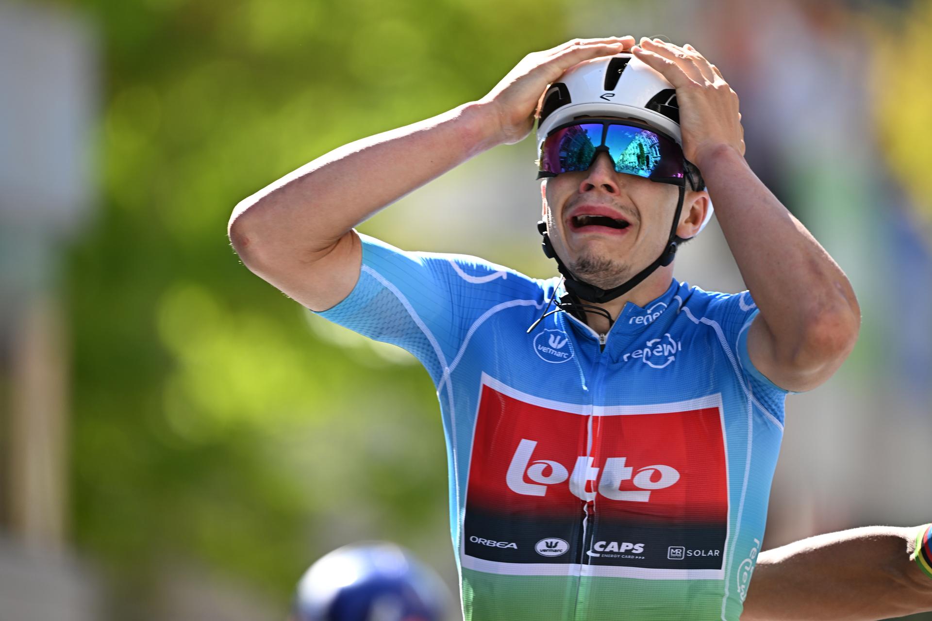 Belgian Arnaud De Lie of Lotto Cycling Team celebrates as he crosses the finish line to win the fifth and last stage of the 'Renewi Tour' multi-stage cycling race, 185km from and to Leuven on Sunday 24 August 2025. The five-day race takes place in Belgium and the Netherlands.  BELGA PHOTO DAVID PINTENS