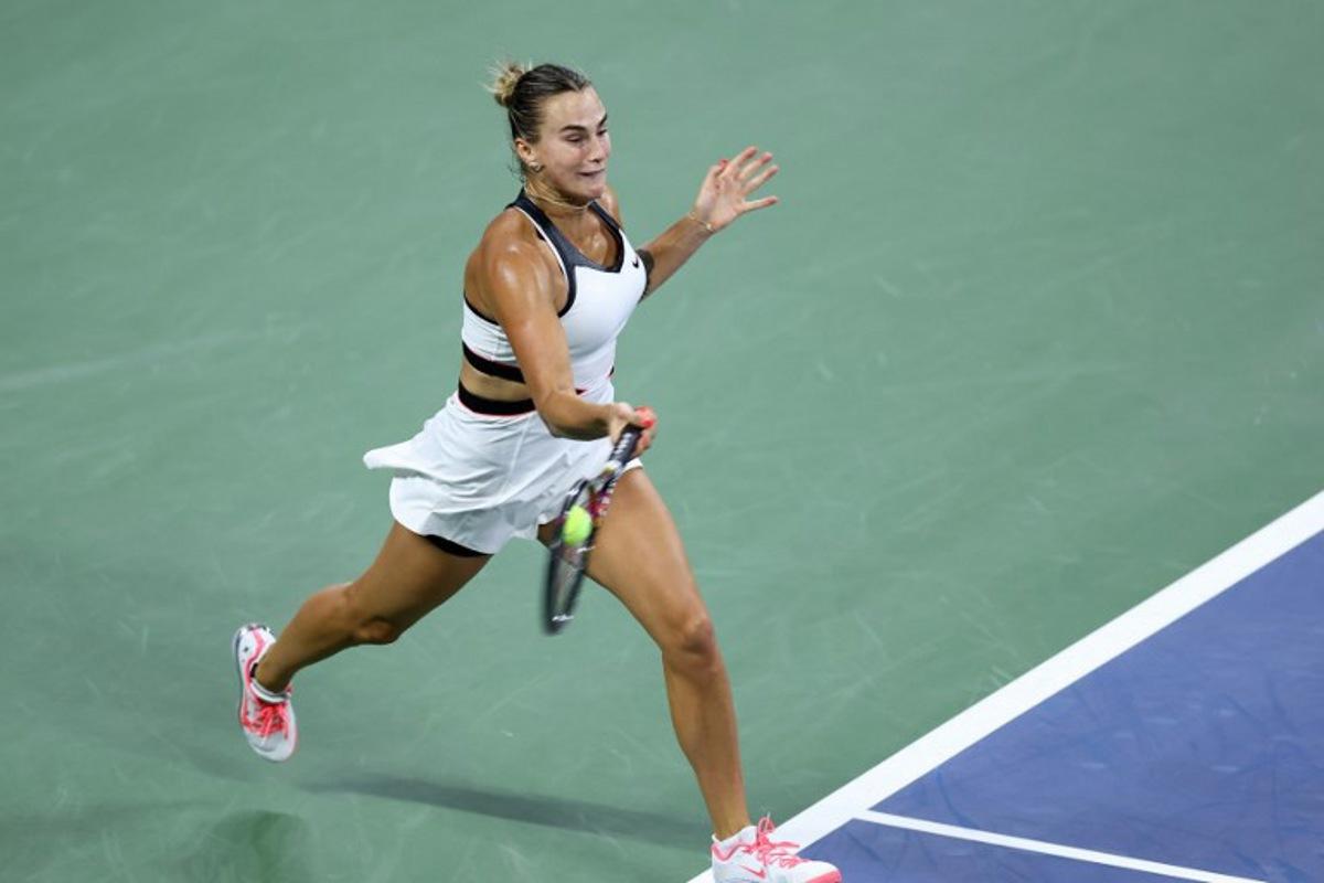 Belarus's Aryna Sabalenka plays a forehand return to Spain's Cristina Bucsa during their women's singles round of 16 tennis match on day eight of the US Open tennis tournament at the USTA Billie Jean King National Tennis Center in New York City, on August 31, 2025.  CHARLY TRIBALLEAU / AFP