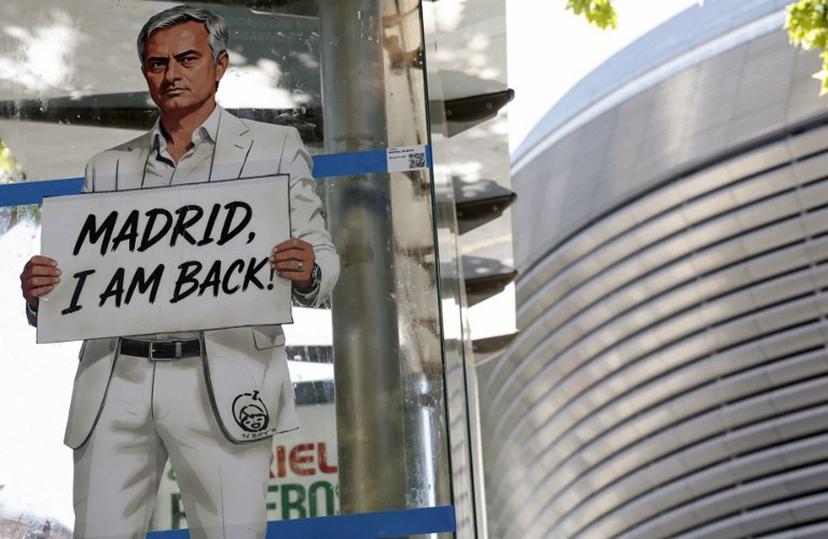A mural by Italian urban artist Salvatore Benintende aka "TV BOY" depicting Portuguese coach Jose Mourinho is seen in front of the Santiago Bernabeu stadium in Madrid on May 21, 2026.   Benfica coach Jose Mourinho confirmed on May 17, 2026 his agent Jorge Mendes has been in contact with Spanish giants Real Madrid. The veteran Portuguese coach, 63, has been strongly linked with a sensational return to the Santiago Bernabeu 13 years after he left Los Blancos. Mourinho said he personally has not had any contact with Madrid president Florentino Perez, or anyone else at the club, and that his future will be decided in the coming week.  OSCAR DEL POZO / AFP
