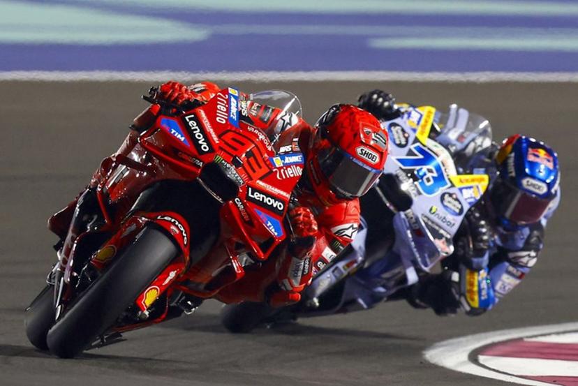 Ducati Lenovo's Spanish rider Marc Marquez and BK8 Gresini Racing MotoGP's Spanish rider Alex Marquez compete during the Qatar Moto GP Grand Prix sprint race at the Lusail International Circuit on April 12, 2025.  Karim JAAFAR / AFP