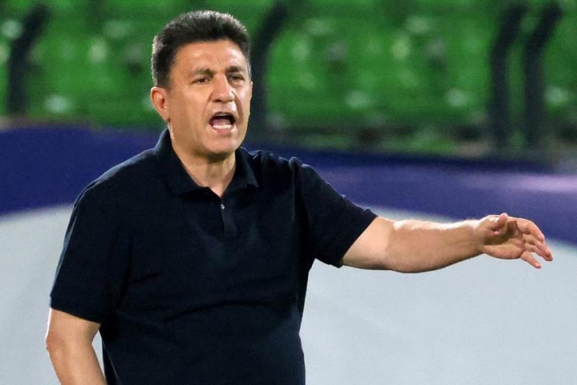 Iran's coach Amir Ghalenoei speaks to his players during the FIFA World Cup 2026 Asia zone qualifiers group A football match between Iran and the North Korea at the Azadi Sports Complex in Tehran on June 10, 2025.  ATTA KENARE / AFP