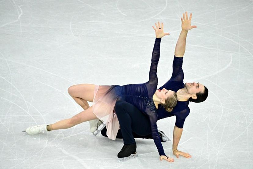 Germany's Minerva Fabienne Hase and Nikita Volodin compete in the figure skating pair skating free skating final during the Milano Cortina 2026 Winter Olympic Games at Milano Ice Skating Arena in Milan on February 16, 2026.  JULIEN DE ROSA / AFP