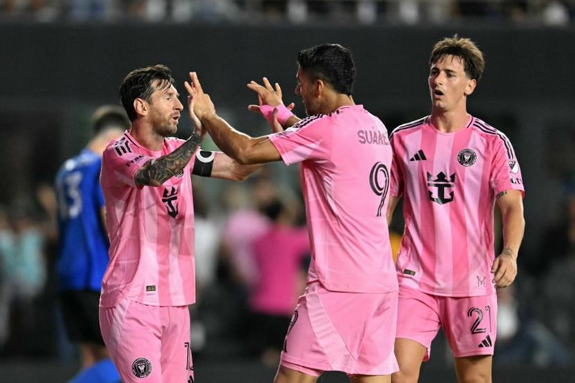 Inter Miami's Uruguayan forward #09 Luis Suarez celebrates scoring his team's second goal with Inter Miami's Argentine forward #10 Lionel Messi (L) during the Major League Soccer match between Inter Miami CF and CF Montreal at Chase Stadium in Fort Lauderdale, Florida, on May 28, 2025.  CHANDAN KHANNA / AFP