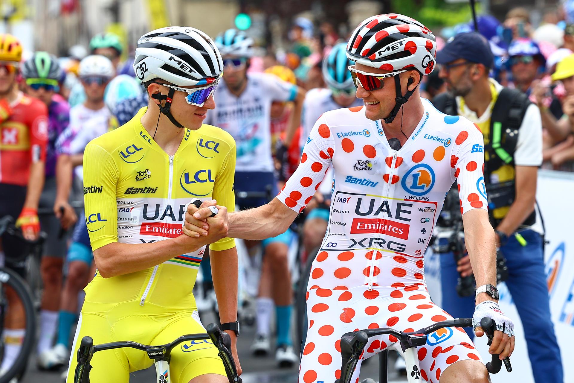 Slovenian Tadej Pogacar of UAE Team Emirates and Belgian Tim Wellens of UAE Team Emirates pictured at the start of stage 10 of the 2025 Tour de France cycling, from Ennezat to Le Mont-Dore Puy de Sancy (169 km), on Monday 14 July 2025 in France. The 112th edition of the Tour de France starts on Saturday 5 July in Lille, France, and will finish in Paris, France on the 27th of July. BELGA PHOTO DAVID PINTENS