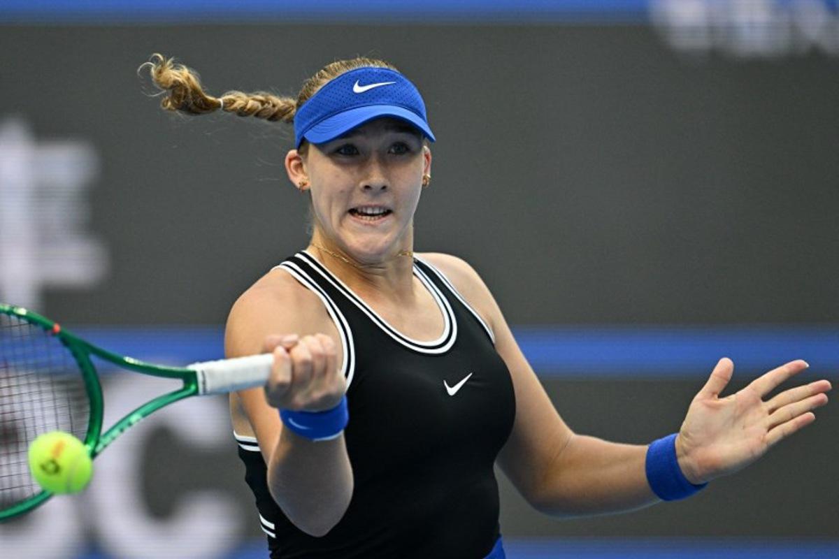 Russia's Mirra Andreeva hits a return to Czech Republic's Nikola Bartunkova during their women's singles semi-final at the China Open tennis tournament in Beijing on October 10, 2026.  Pedro Pardo / AFP