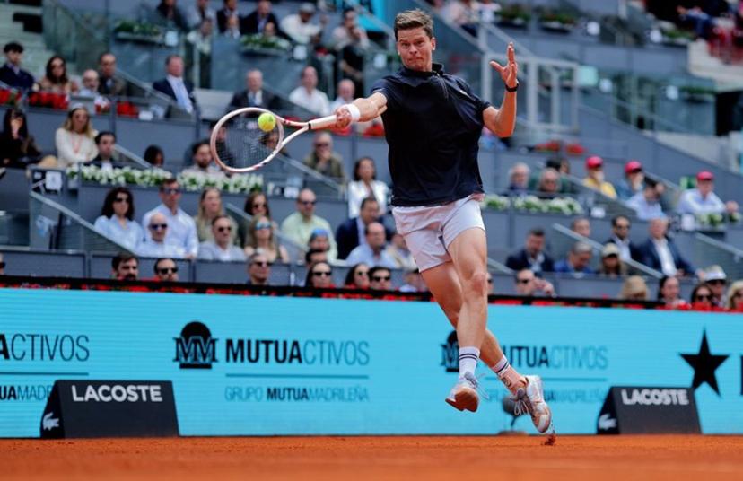 Belgium's Alexander Blockx returns the ball to Norway's Casper Ruud during their 2026 ATP Tour Madrid Open tennis tournament quarter-final singles match at the Caja Magica in Madrid, on April 30, 2026.  Thomas COEX / AFP