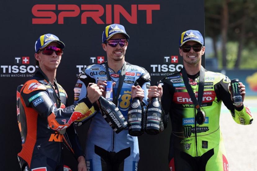 (From L) Team Red Bull KTM Factory Racing's Pedro Acosta, Team Gresini Racing MotoGP's Alex Marquez and Team Pertamina Enduro VR46 Racing Team's Fabio Di Giannantonio celebrate on the podium after the Sprint Race at the Catalunya Moto GP Grand Prix at the Catalunya racetrack in Montmelo, near Barcelona, on May 16, 2026.  Lluis GENE / AFP