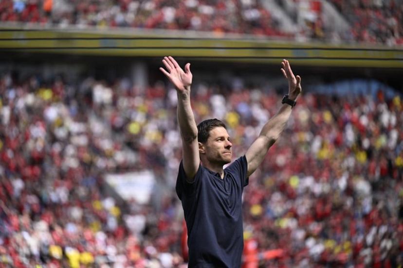 Bayer Leverkusen's outgoing Spanish head coach Xabi Alonso reacts during his farewell prior to the start of the German first division Bundesliga football match between Bayer 04 Leverkusen and Borussia Dortmund in Leverkusen, western Germany, on May 11, 2025.  INA FASSBENDER / AFP