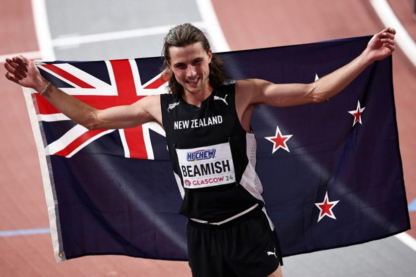 First-placed New Zealand's Geordie Beamish celebrates after winning in the Men's 1500m final during the Indoor World Athletics Championships in Glasgow, Scotland, on March 3, 2024.  Anne-Christine POUJOULAT / AFP