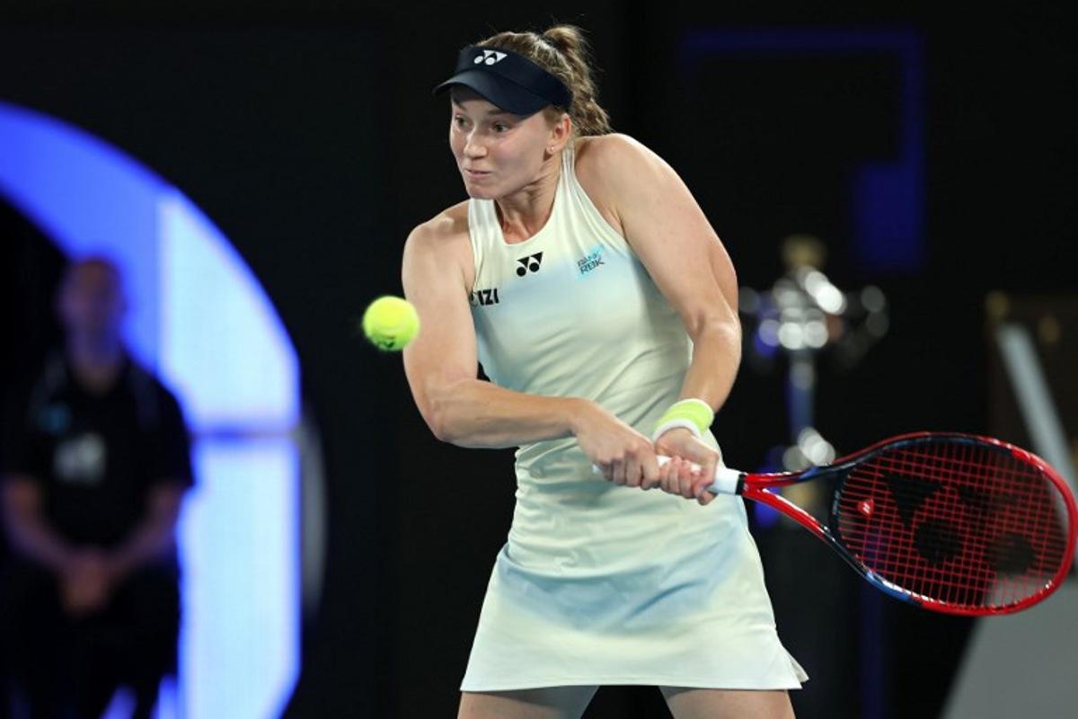 Kazakhstan's Elena Rybakina hits a return to Belarus' Aryna Sabalenka during their women's singles final match on day fourteen of the Australian Open tennis tournament in Melbourne on January 31, 2026.  Martin KEEP / AFP