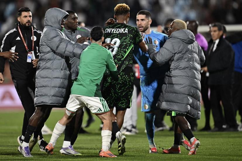 Nigeria's midfielder #18 Raphael Onyedika, Algeria's goalkeeper #23 Luca Zidane and players argue during the Africa Cup of Nations (CAN) quarter-final football match between Algeria and Nigeria at the Grand stadium in Marrakesh on January 10, 2026.   Paul ELLIS / AFP
