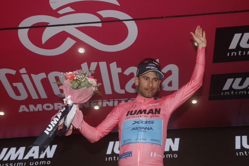 XDS Astana Team's Italian rider Diego Ulissi celebrates the Pink jersey of the overall leader on the podium after the 8th stage of the 108th Giro d'Italia cycling race of 197kms from Giulianova to Castelraimondo on May 17, 2025.  Luca Bettini / AFP