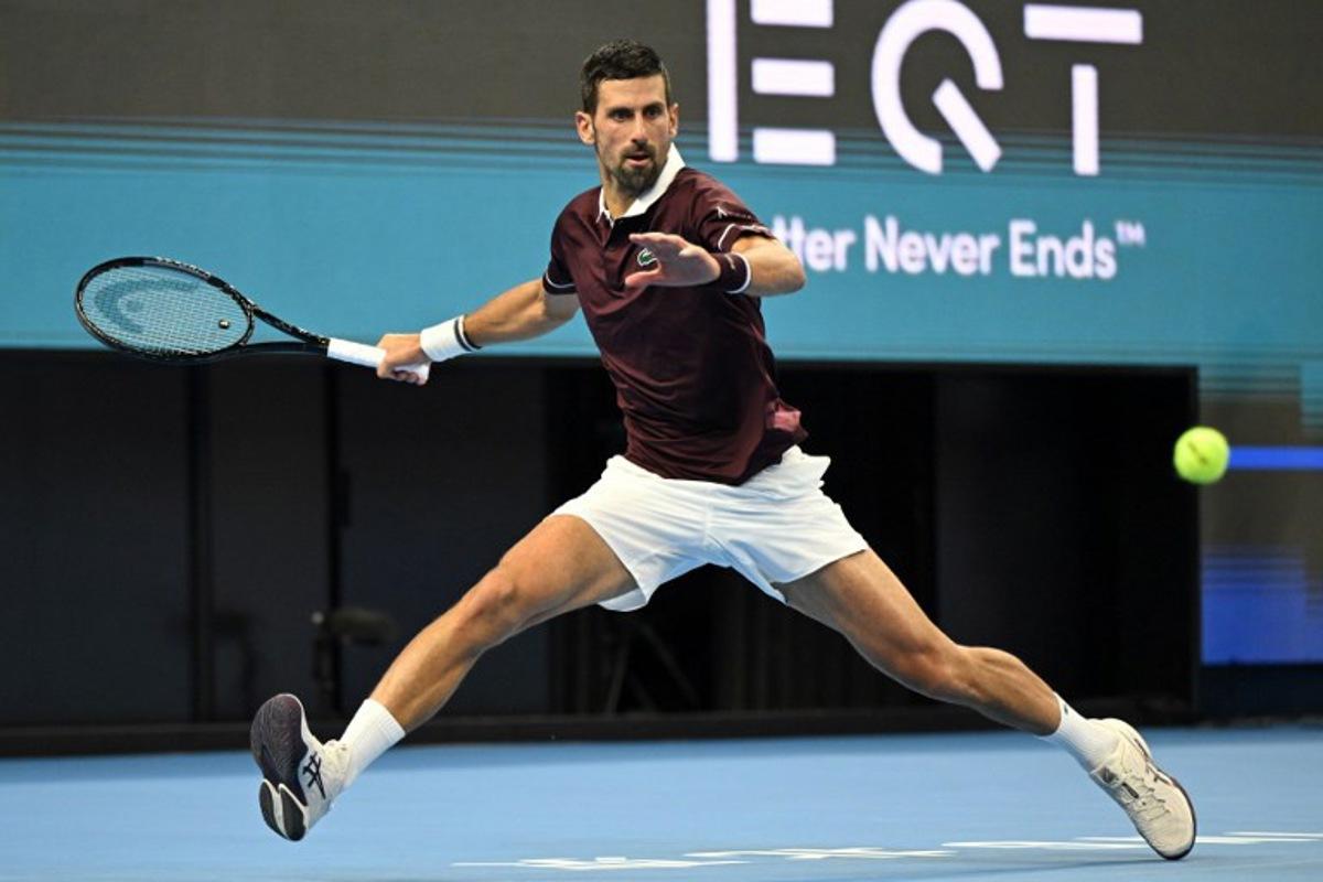 Serbia's Novak Djokovic hits a return to Australia's Alex de Minaur during the men's singles final at the China Open tennis tournament in Beijing on October 6, 2026. Greg Baker / AFP