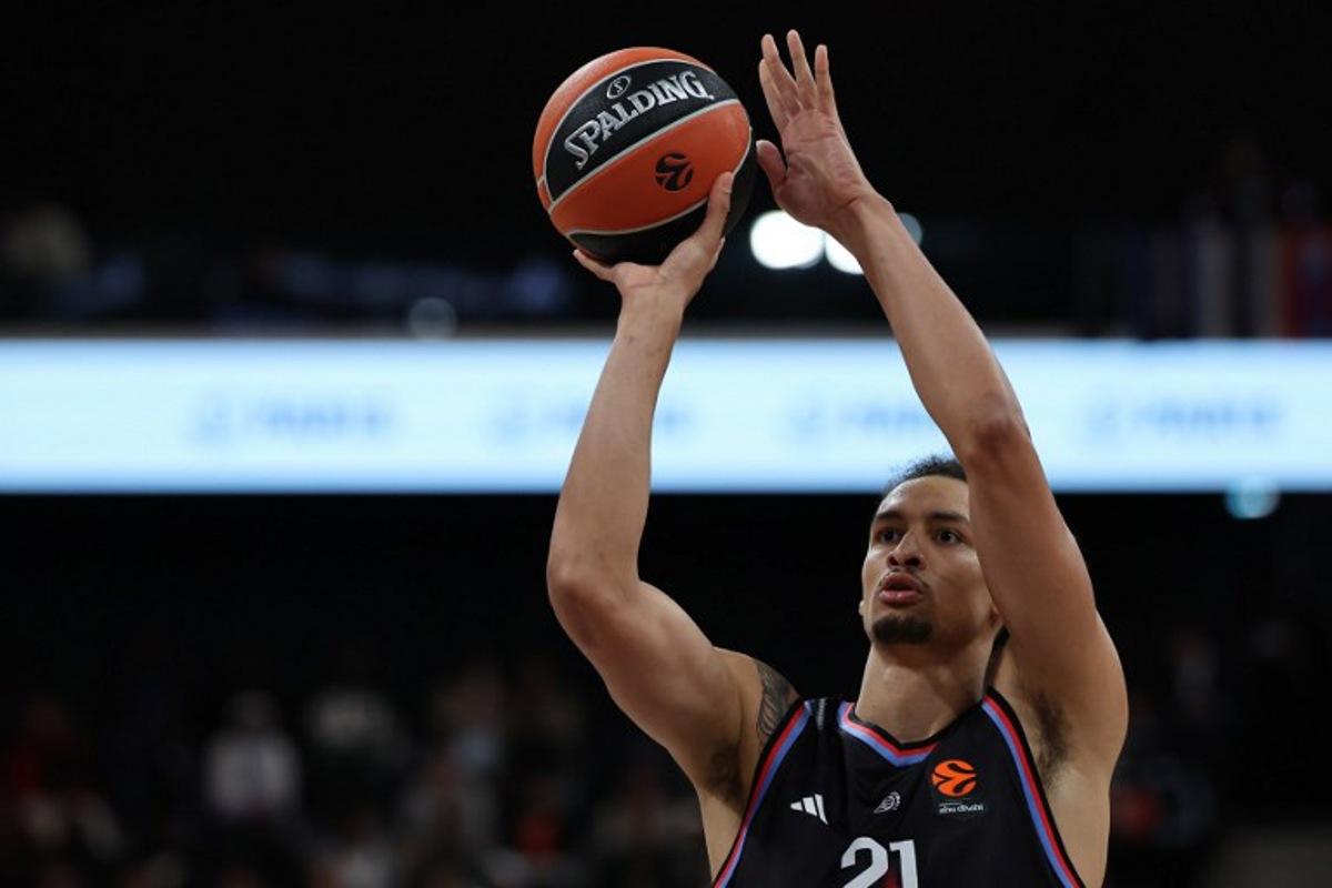 Paris Basketball's Belgian pivot #21 Ismael Bako performs a free throw during the Euroleague basketball match between Paris Basketball and Virtus Bologna at the Adidas Arena, in Paris, on October 9, 2025. Anne-Christine POUJOULAT / AFP