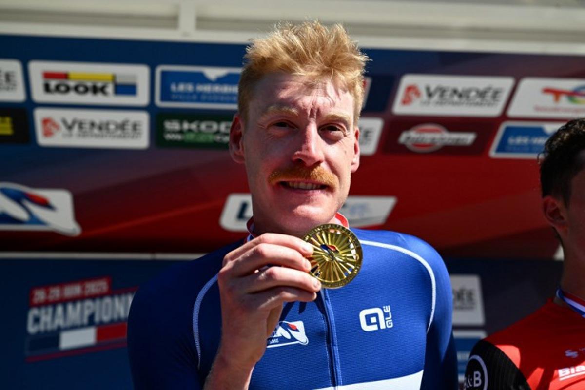 Decathlon-AG2R La Mondiale's French rider Dorian Godon poses with his medal after winning the men's Elite race of the French National Road Cycling championships, in Les Herbiers, western France, on June 29, 2025. Sebastien Salom-Gomis / AFP