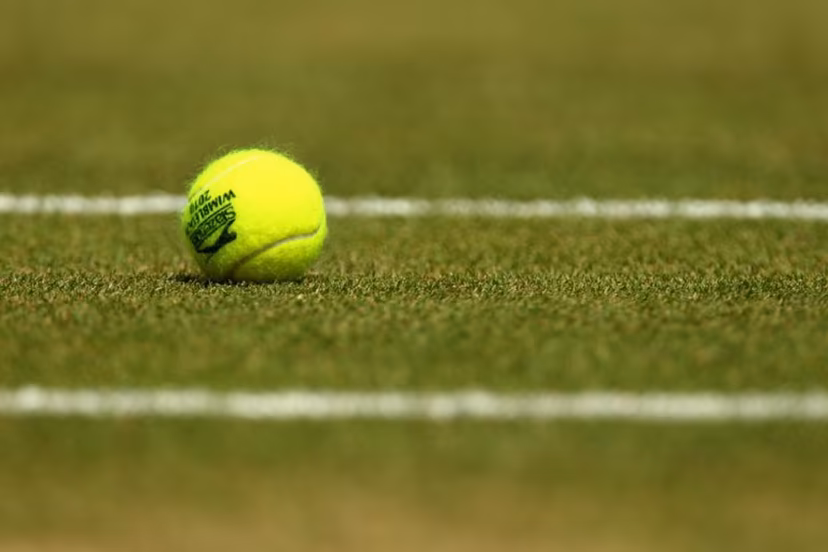 A tennisball is pictured courside during play between Czech player Tomas Berdych and Spanish player Rafael Nadal during the men's singles grand final of the Wimbledon Tennis Championships at the All England Tennis Club, in southwest London on July 4, 2010. AFP PHOTO / GLYN KIRK GLYN KIRK / AFP