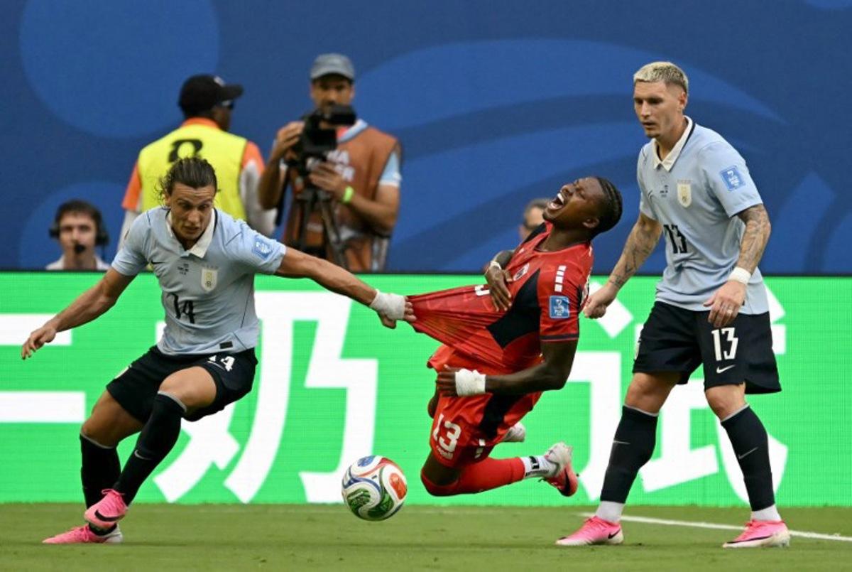 Cape Verde's defender #13 Sidney Lopes Cabral, Uruguay's forward #14 Agustin Canobbio and defender #13 Guillermo Varela fight for the ball during the 2026 World Cup Group H football match between Uruguay and Cape Verde at the Miami Stadium in Miami Gardens on June 21, 2026. CHANDAN KHANNA / AFP